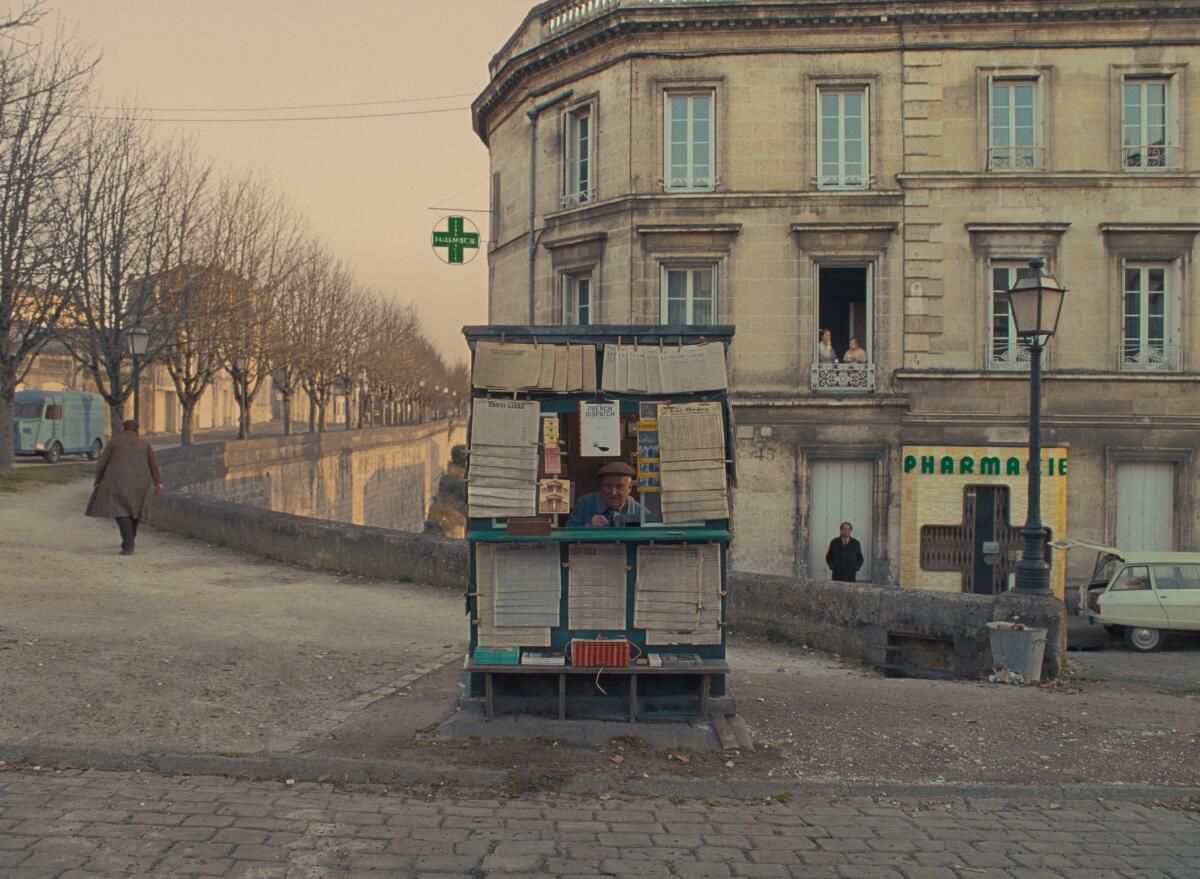 A newspaper stand outside a building in France