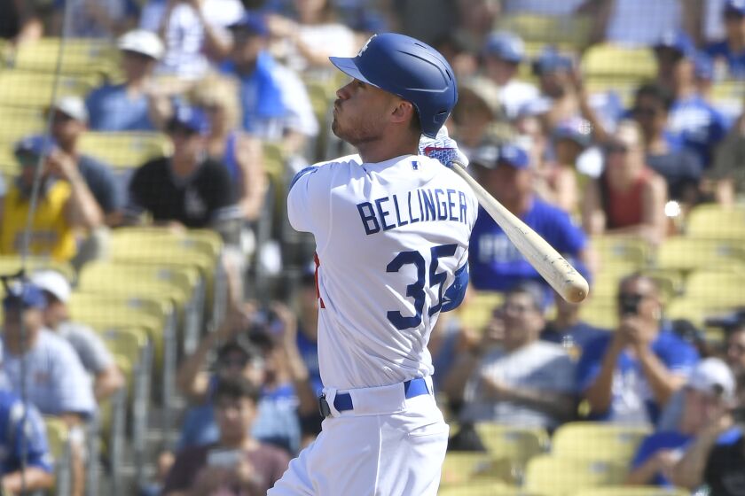 LOS ANGELES, CA - SEPTEMBER 22: Cody Bellinger #35 of the Los Angeles Dodgers hits a grand slam home run against the Colorado Rockies in the fifth inning at Dodger Stadium on September 22, 2019 in Los Angeles, California. (Photo by John McCoy/Getty Images)
