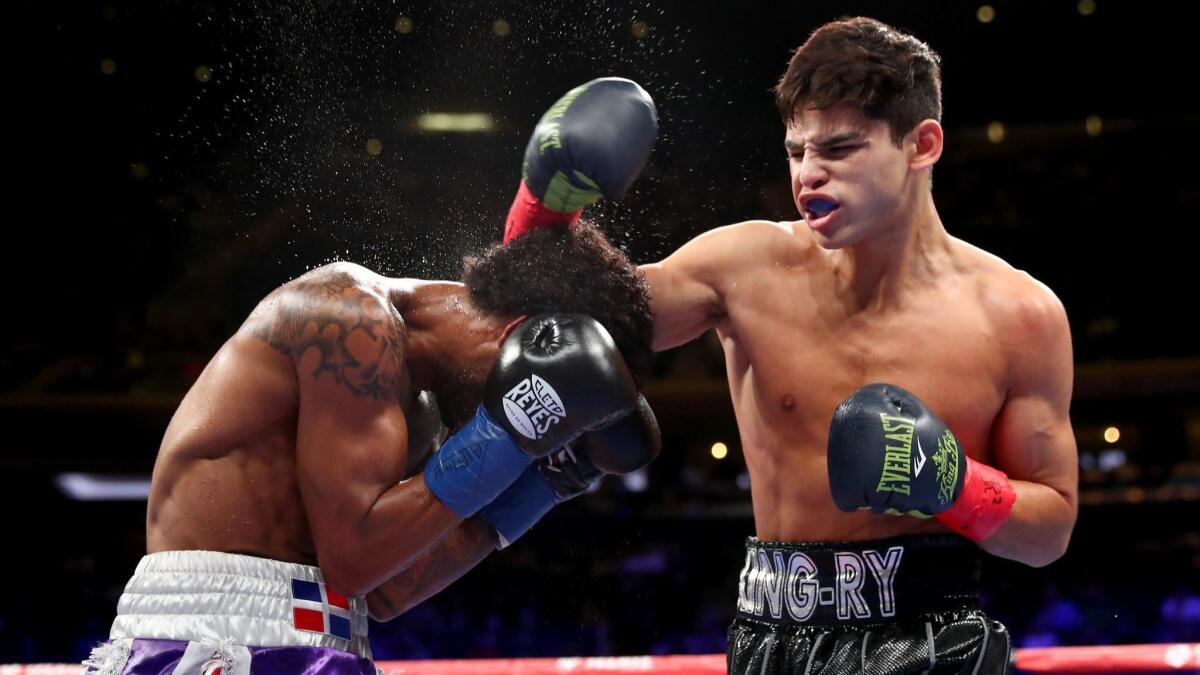 Ryan Garcia (right) lands a punch against Braulio Rodriguez (left) during their Super Featherweight bout at Madison Square Garden on December 15, 2018.