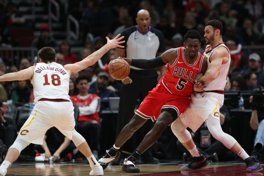 Bulls forward Bobby Portis (5) drives against Cavaliers forward Larry Nance Jr. in the first half at the United Center on Sunday, Jan. 27, 2019.