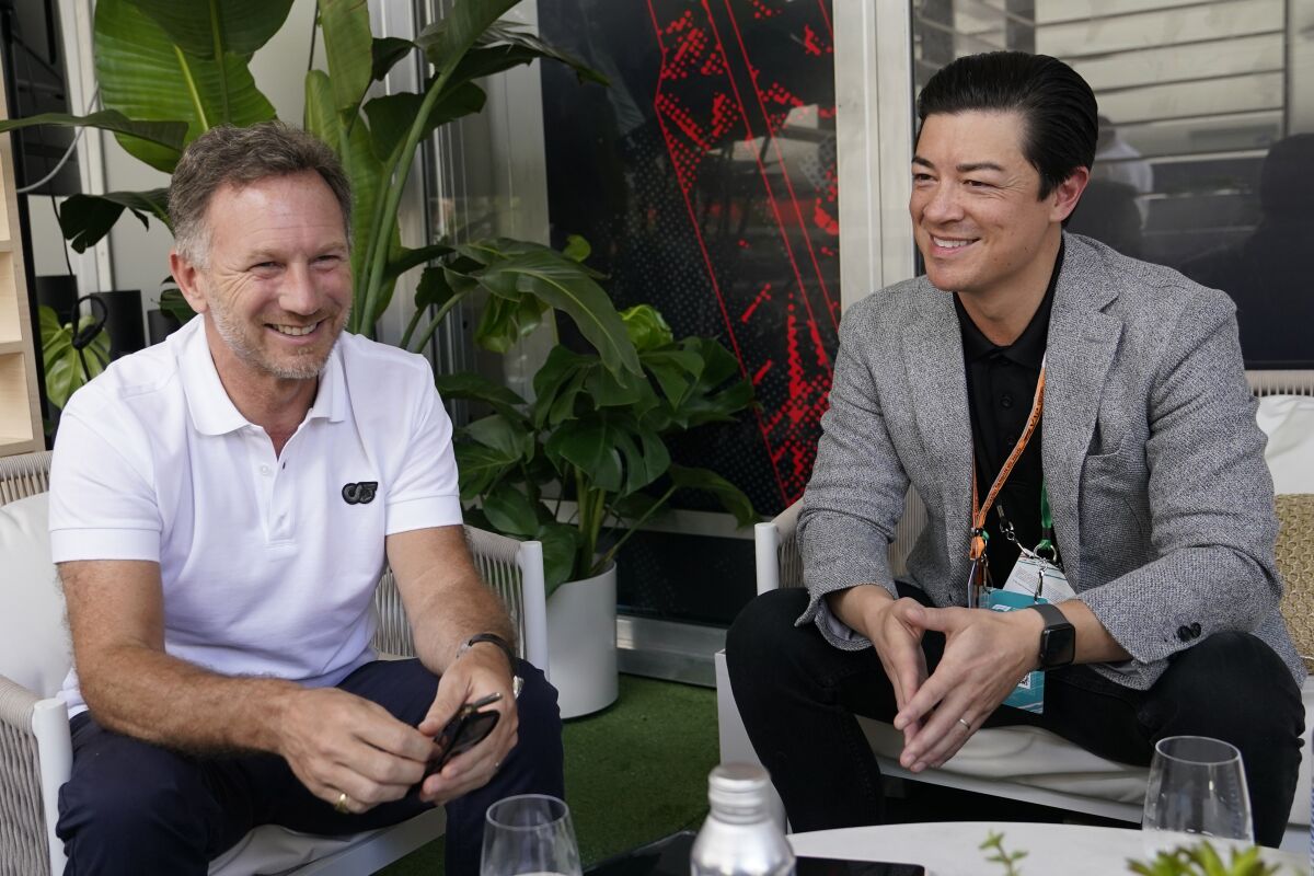 Red Bull team principal Christian Horner, left, speaks with with Keith Sheldon, president of entertainment of Hard Rock International, right, during an interview in advance of the Formula One Miami Grand Prix auto race at the Miami International Autodrome, Thursday, May 5, 2022, in Miami Gardens, Fla. Hard Rock International, which is headquartered in Davie about 10 miles from Hard Rock Stadium, announced a multi-year sponsorship deal with Red Bull on Thursday as drivers arrived ready to walk the purpose-built venue. The race is Sunday. (AP Photo/Lynne Sladky)