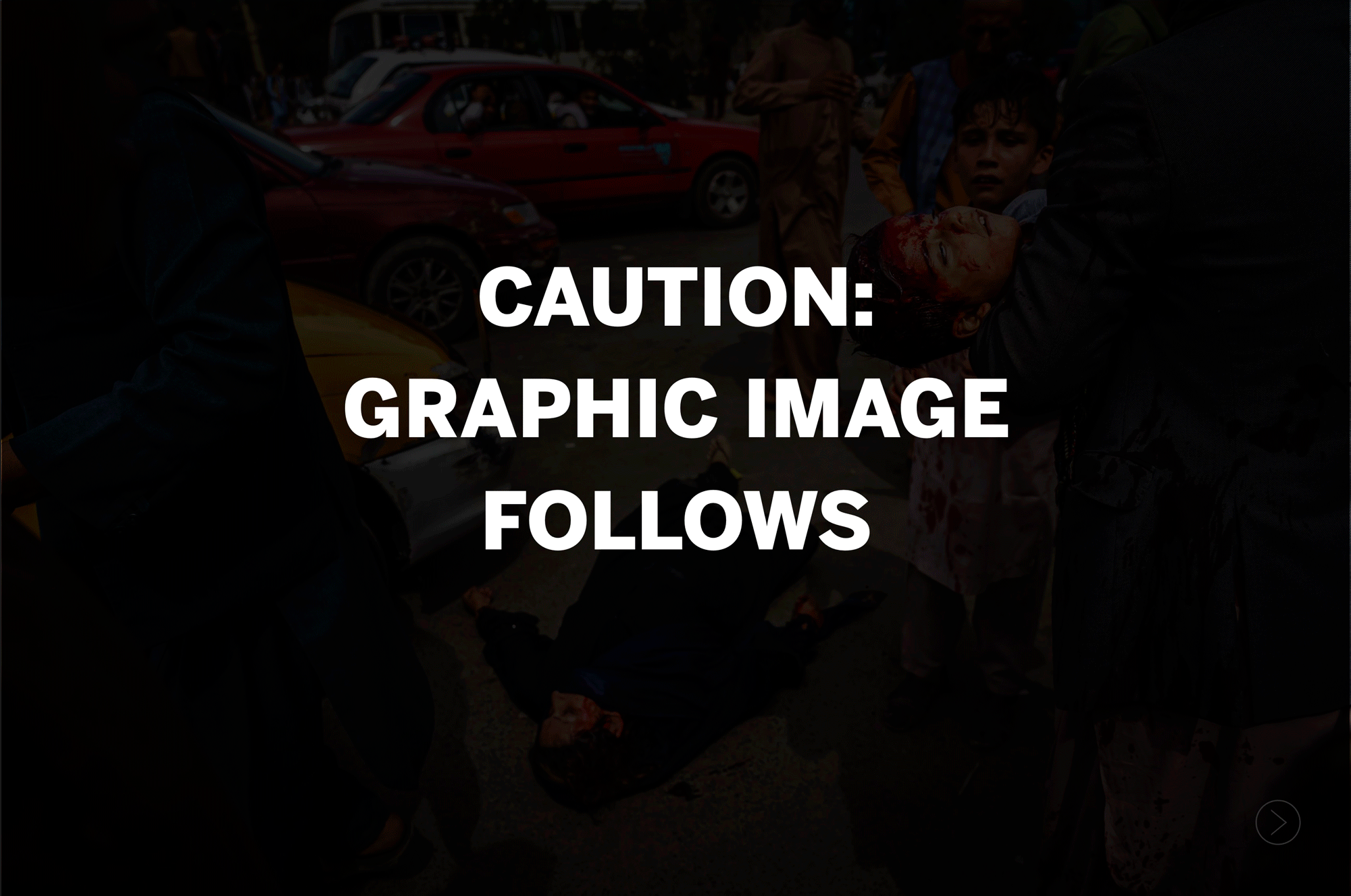 Aug. 17: A man carries a bloodied child while a bloodied woman lies on the street
