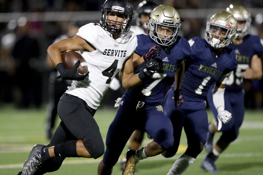 SHERMAN OAKS, CALIF. - SEP. 27, 2019. Servite wide receiver Tetairoa Mcmillan gets big yardage after a making a catch against Notre Dame in the second quarter in Sherman Oaks on Friday night, Sep. 27, 2019. (Luis Sinco/Los Angeles Times)