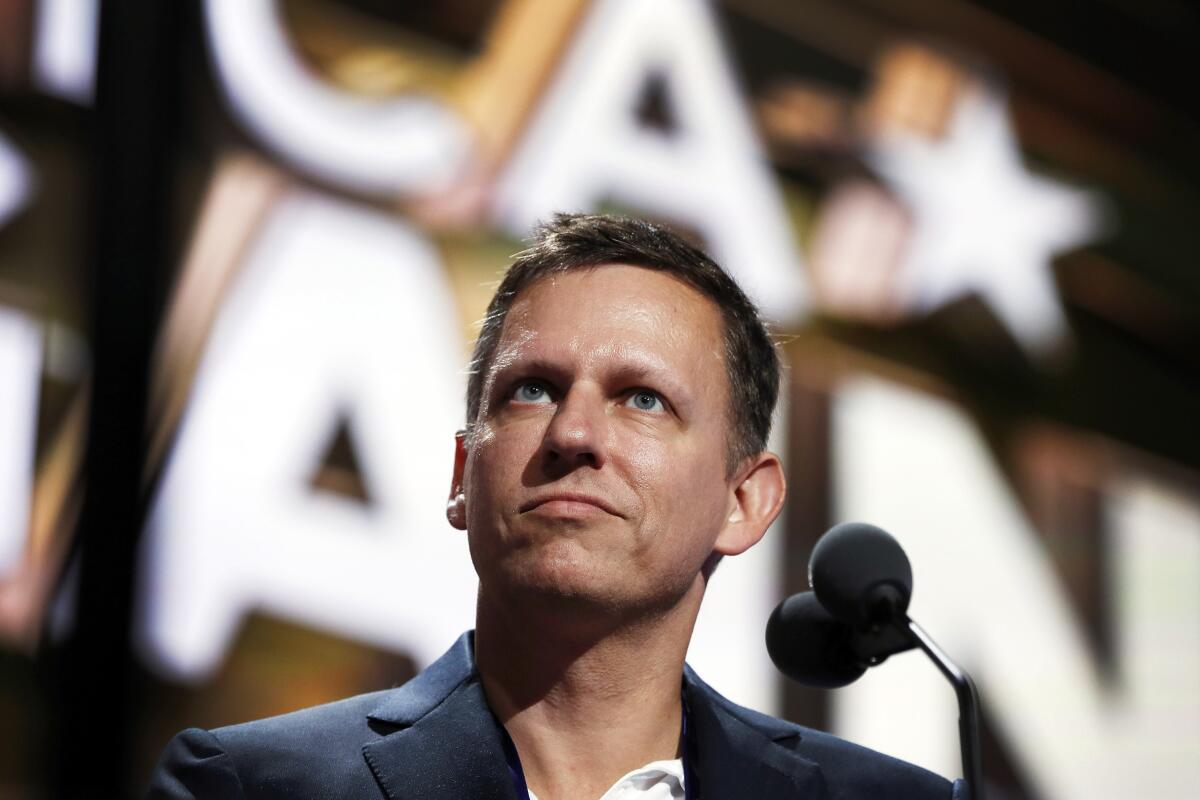 Peter Thiel looks out above a microphone