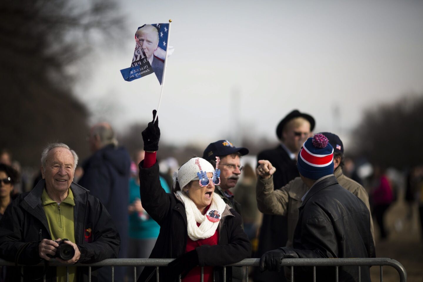 A woman waves a flag.