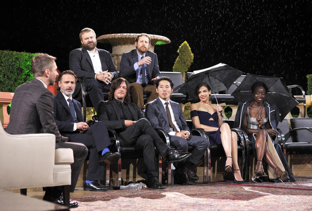 Host Chris Hardwick (bottom row from left), actors Andrew Lincoln, Norman Reedus, Steven Yeun, Lauren Cohan, Danai Gurira and (top row from left) creator Robert Kirkman and showrunner Scott Gimple at the Hollywood Forever Cemetery on Sunday for "Talking Dead Live."