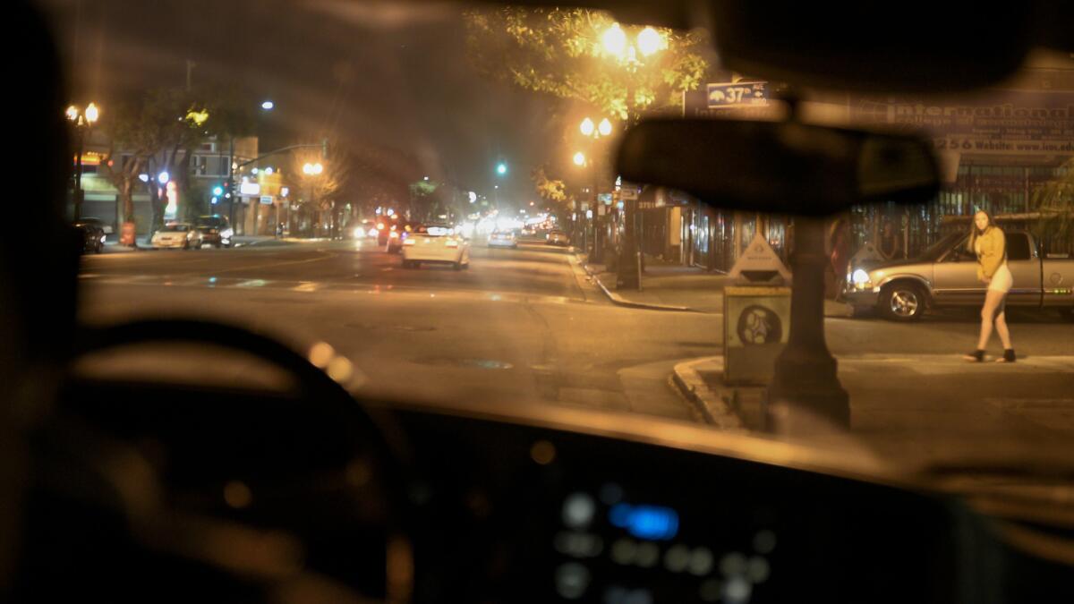 Members of Victory Outreach church drive along International Boulevard in Oakland, seeking to help women working as prostitutes.