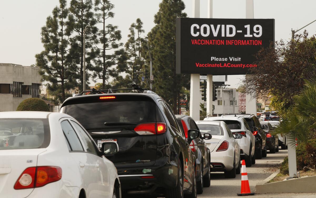 Cars line up as Angelenos try to get vaccinated in Inglewood.