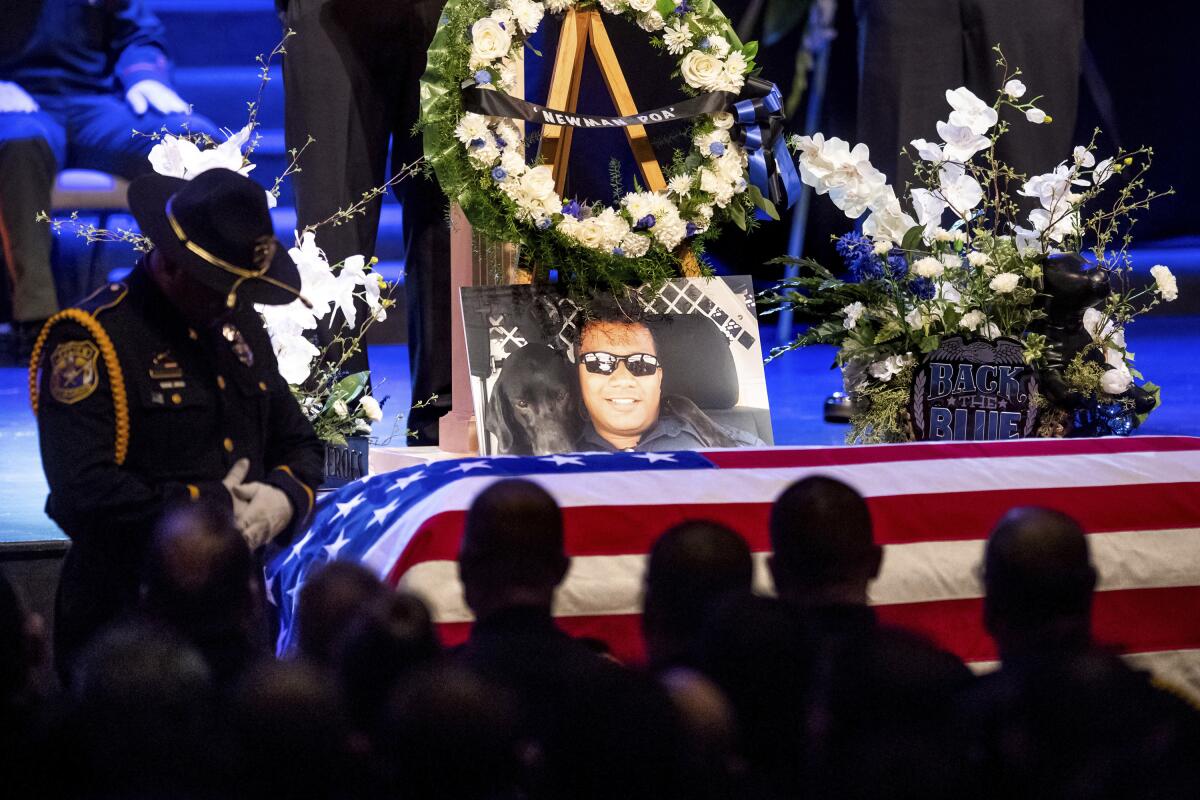 A photo of slain Newman police Cpl. Ronil "Ron" Singh rests atop his casket during his funeral on Jan. 5, 2019.