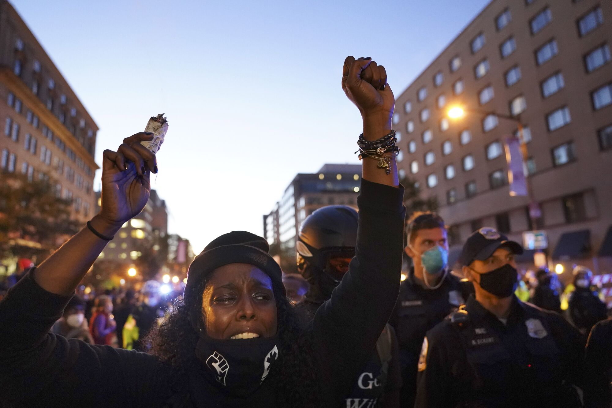 Demonstrators wait outside the White House for election results Tuesday night.