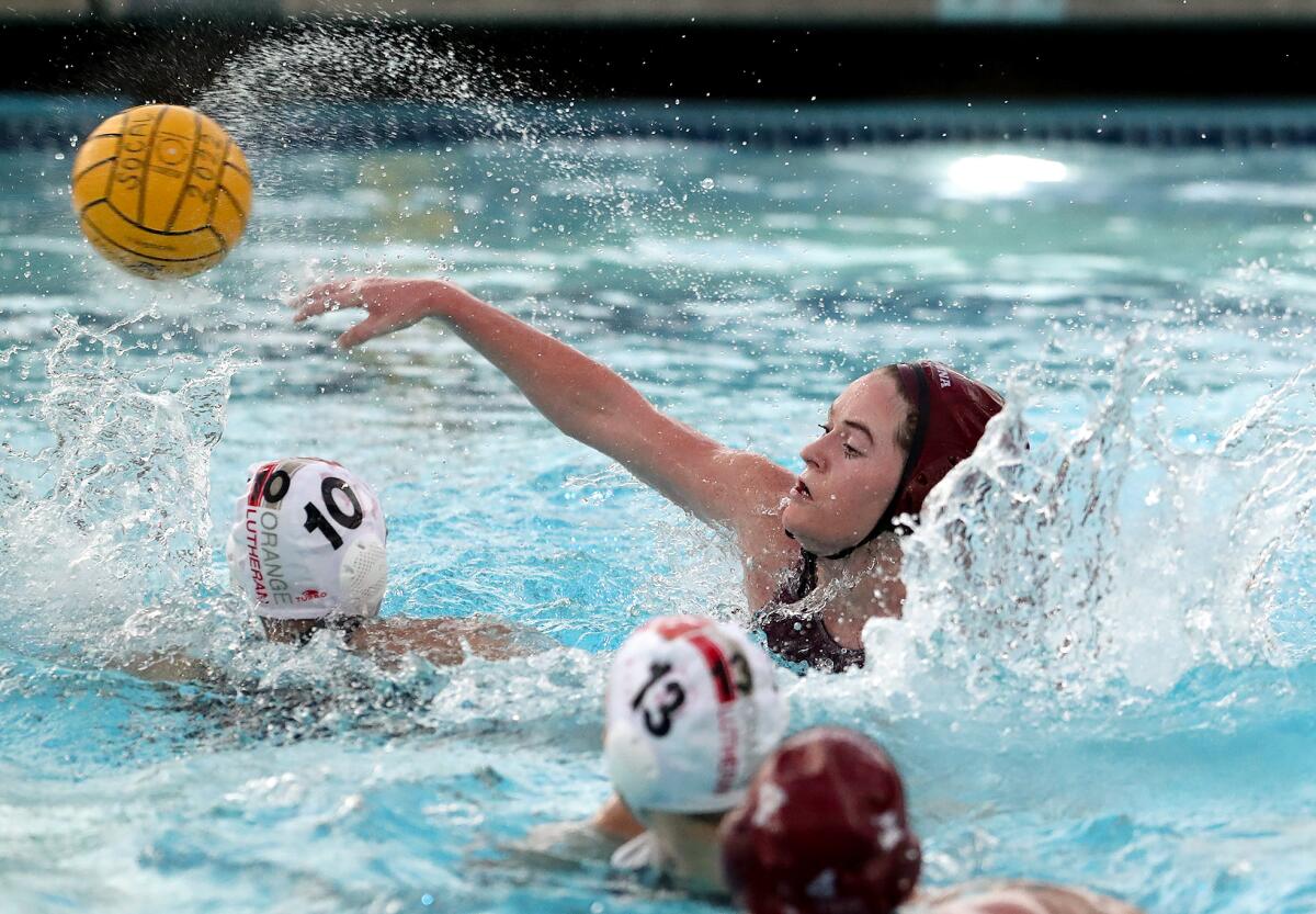 Lela McCarroll throws in a goal over Orange Lutheran's Michelle Urkov during Wednesday's Open Division semifinal match.