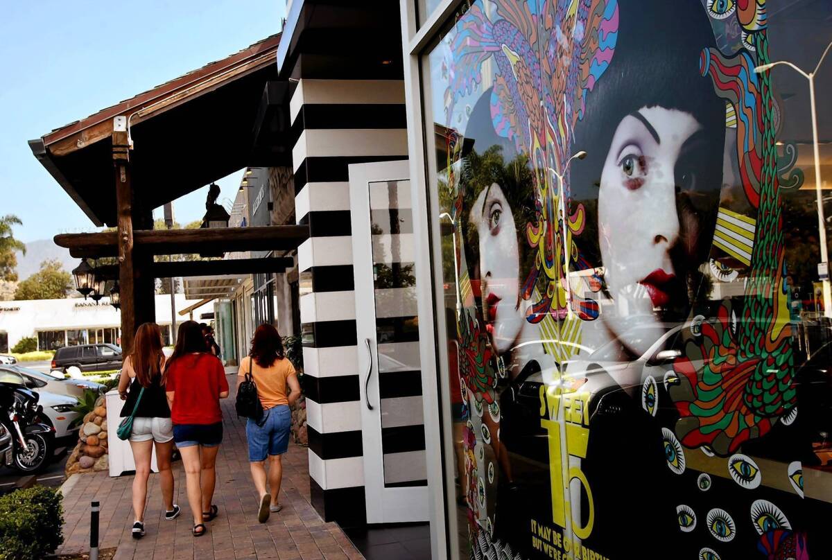 Shoppers stroll past a Sephora cosmetics store, which used to be a ballet studio. The influx of upscale chains is upsetting some longtime Malibu residents.