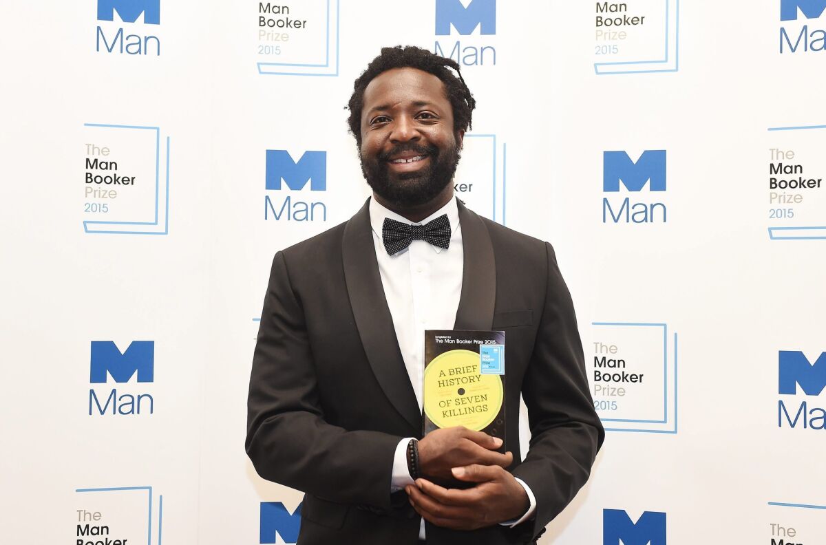 Marlon James, winner of the 2015 Man Booker Prize for Fiction for his novel "A Brief History of Seven Killings," poses for photographs after the announcement in London.