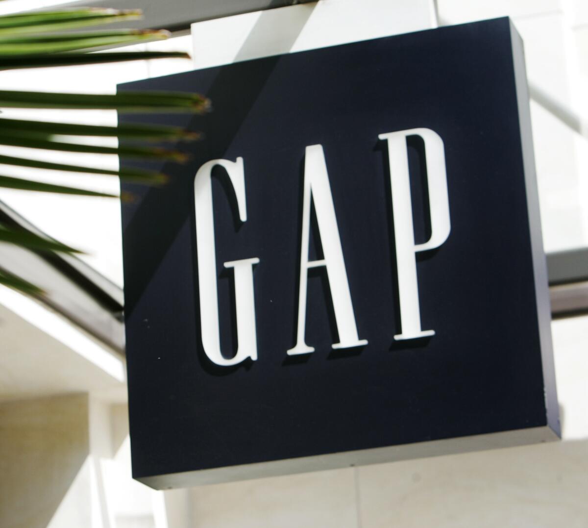 FILE - In this Thursday, April 12, 2007 file photo, A sign at a Gap store is seen in The Grove shopping area in Los Angeles. A dozen retailers including Gap and H&M are collaborating on a campaign this fall to enlist customers to combat bad behavior against retail workers. The campaign is being spearheaded by Open to All and two other groups, and comes as workers face increased harassment as they try to enforce social distancing and mask protocols during the pandemic. (AP Photo/Reed Saxon, File)