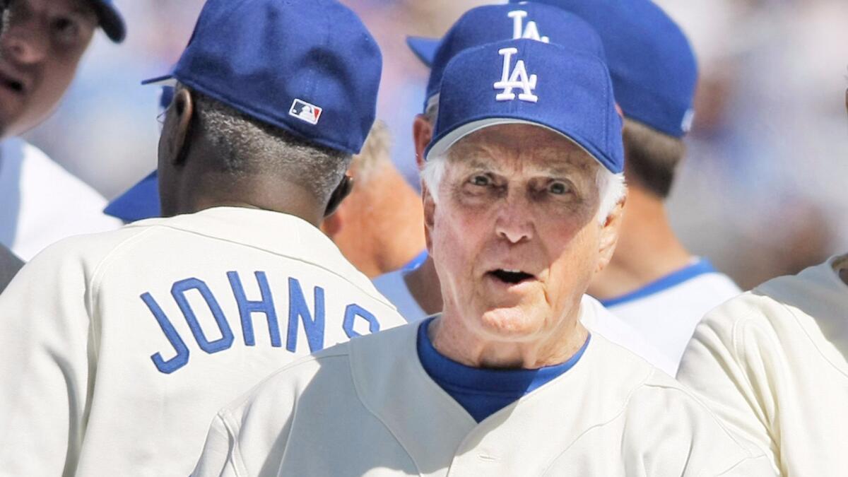Former Dodger great Carl Erskine is pictured after throwing out the first pitch of the Dodgers' season opener against the San Francisco Giants on March 31, 2008.
