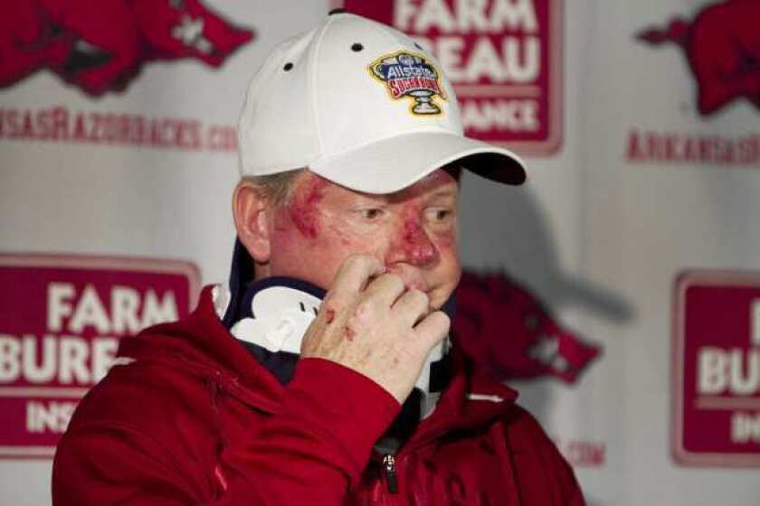 Arkansas football coach Bobby Petrino speaks during a news conference after a motorcycle crash.