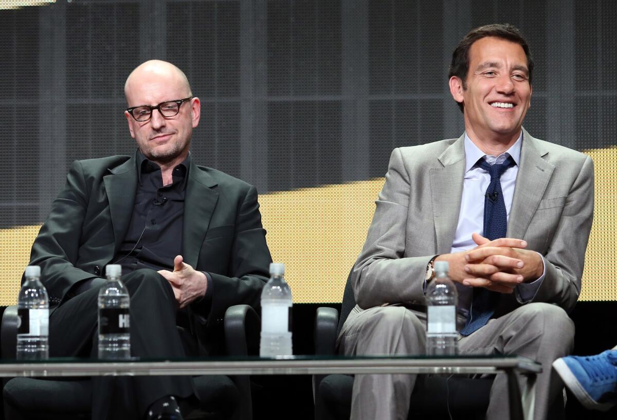 Director Steven Soderbergh, left, and actor Clive Owen tout their upcoming Cinemax drama "The Knick" at the Television Critics Assn. press tour Thursday in Beverly Hills.