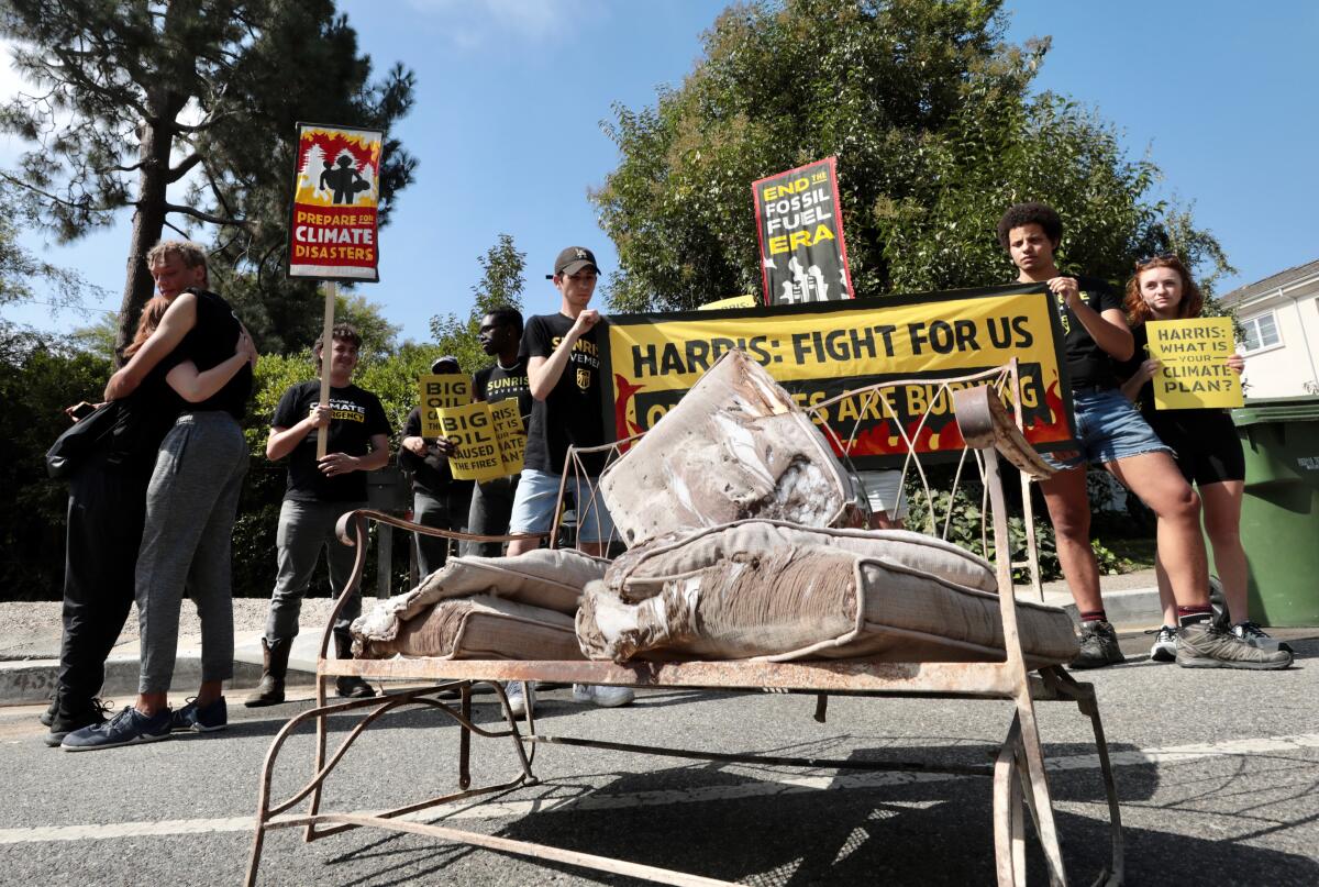 Sunrise Movement activists placed scorched couch cushions outside Vice President Kamala Harris' home in Brentwood.