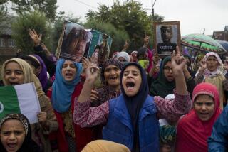 FILE-Kashmiris shout slogans during a protest after Friday prayers against the abrogation of article 370, on the outskirts of Srinagar, Indian controlled Kashmir, Oct. 4, 2019. (AP Photo/ Dar Yasin, File)