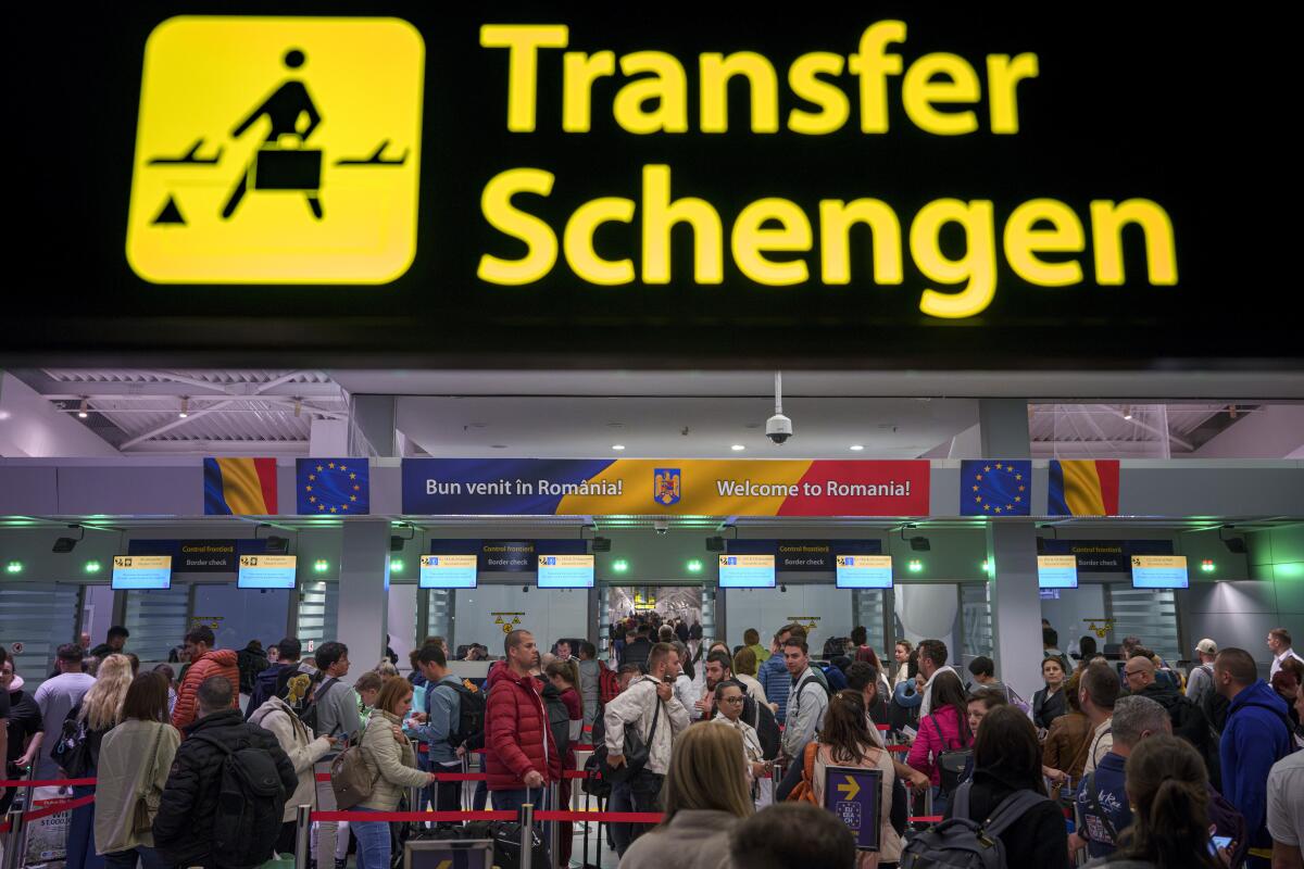 Passengers arriving at the Henri Coanda International Airport in Otopeni, near Bucharest, Romania.