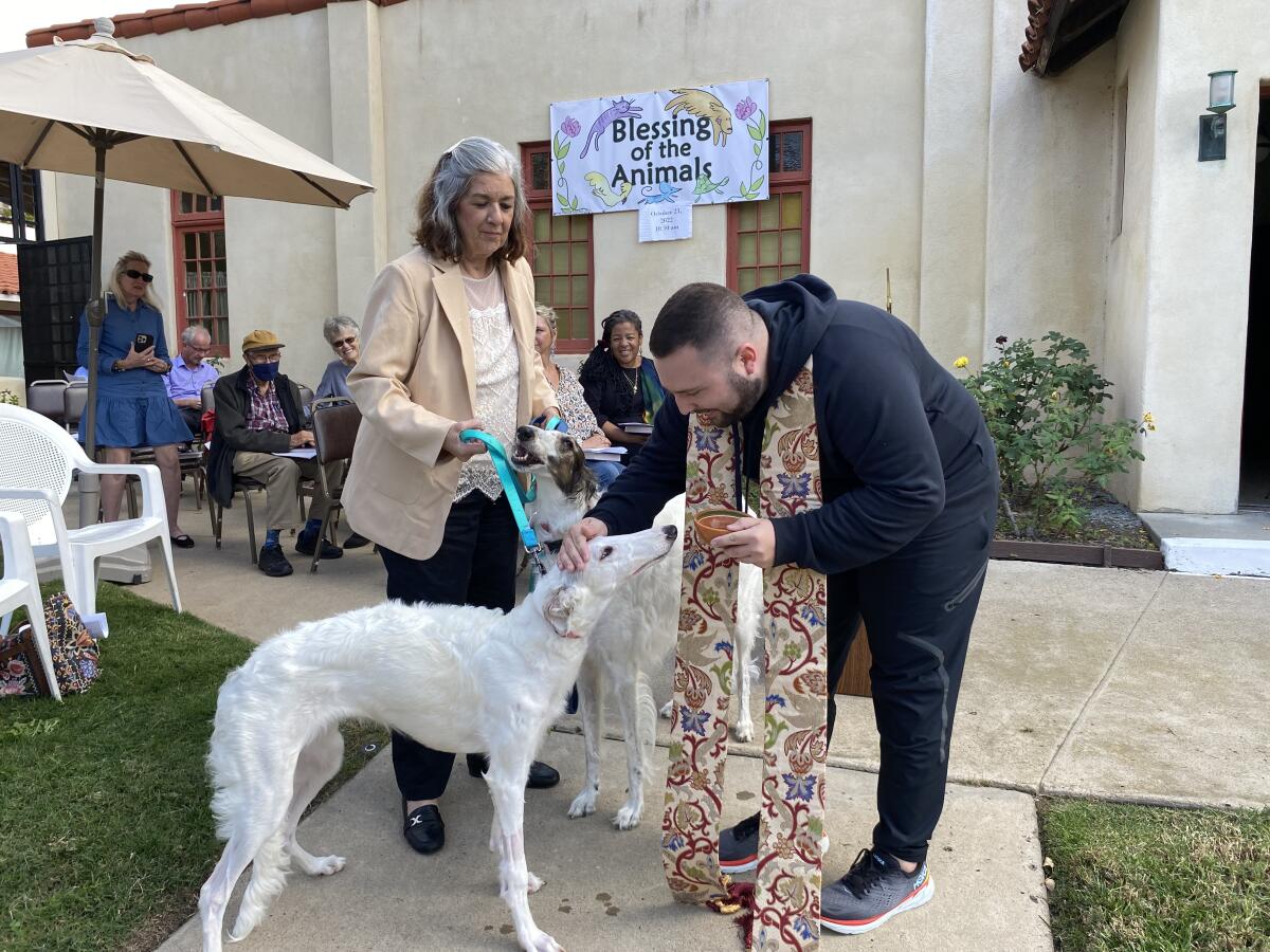 Pastor Tim Seery conducts the annual Blessing of the Animals at the Congregational Church of La Jolla Oct. 23.