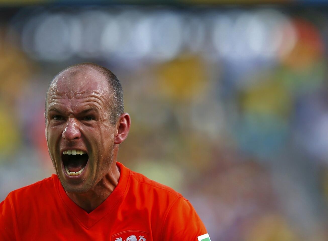 Arjen Robben of the Netherlands celebrates after winning their 2014 World Cup round of 16 game against Mexico at the Castelao arena in Fortaleza