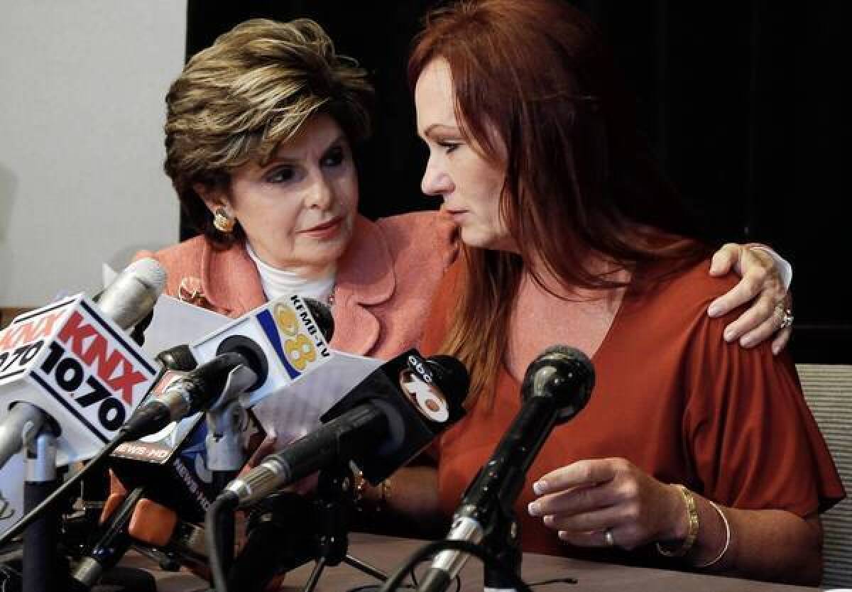 Attorney Gloria Allred, left, puts an arm around nurse Michelle Tyler after she alleged during a news conference in San Diego that Mayor Bob Filner had behaved inappropriately with her during a June meeting to ask for help for an injured former Marine.