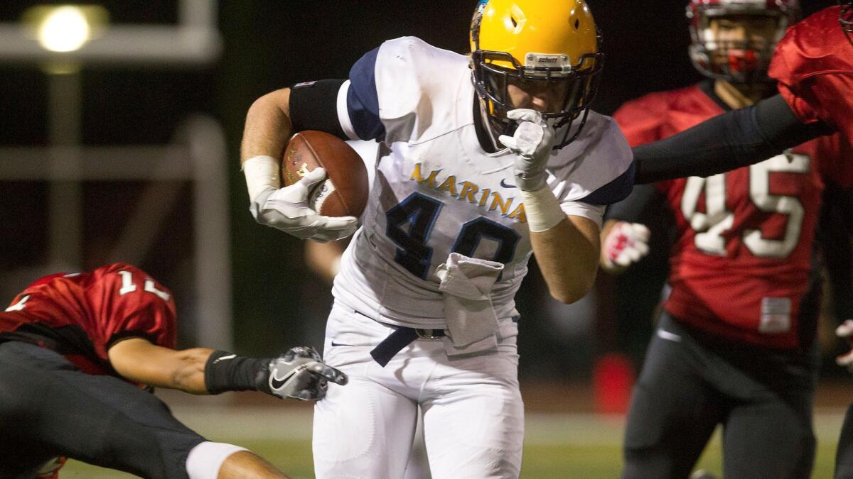 Marina High's Blaine Riederich, seen here during a game in 2016, rushed for 123 yards and two touchdowns Thursday night to lead the Vikings to a 26-15 victory against Torrance.