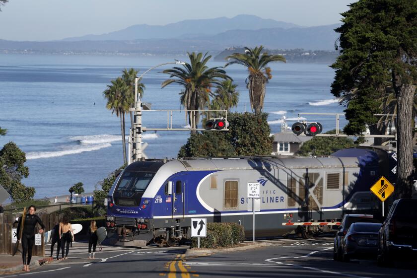 San Diego, CA, November 22, 2023: An Amtrak Surfliner train travels through Powerhouse Park in Del Mar on Wednesday, November 22, 2023. (K.C. Alfred / The San Diego Union-Tribune)