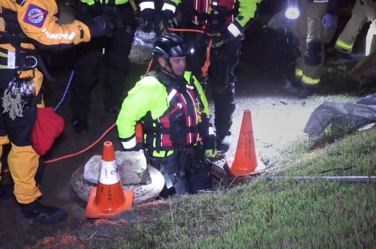 In these images taken from On Scene TV video, San Diego Fire Rescue lifeguards, firefighters and Border Patrol worked to rescue 20 people who were trapped in a culvert during pounding rain while attempting to enter the country illegally on Thanksgiving night, November 28, 2019, two miles west of the San Ysidro Port of Entry in San Diego, California.