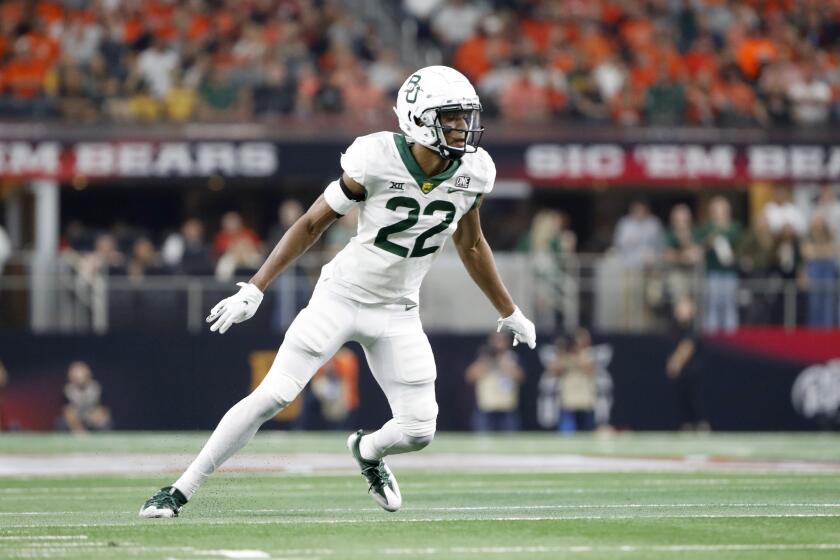 Baylor safety JT Woods tracks the play during the first half of the Big 12 Championship NCAA college football game against Oklahoma State in Arlington, Texas, Saturday, Dec. 4, 2021. (AP Photo/Roger Steinman)