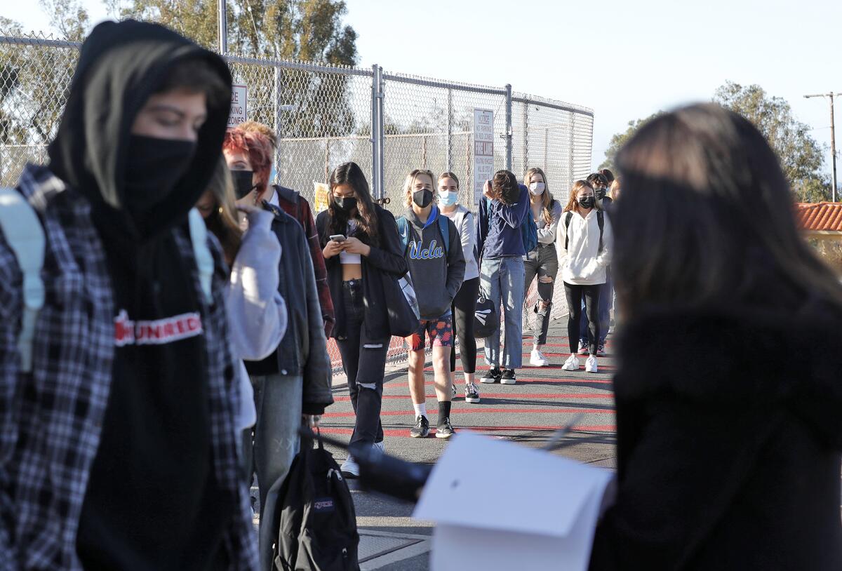 Students arrive for in-person instruction at Laguna Beach High on Wednesday.