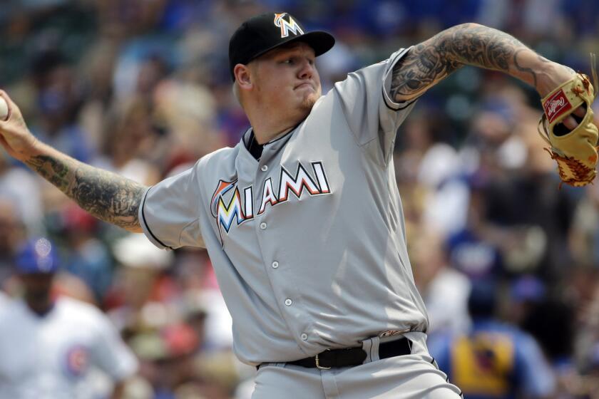 Mat Latos, then playing for Miami, delivers a pitch during a game against the Chicago Cubs on July 5. He is scheduled to make his Dodgers debut on Sunday.