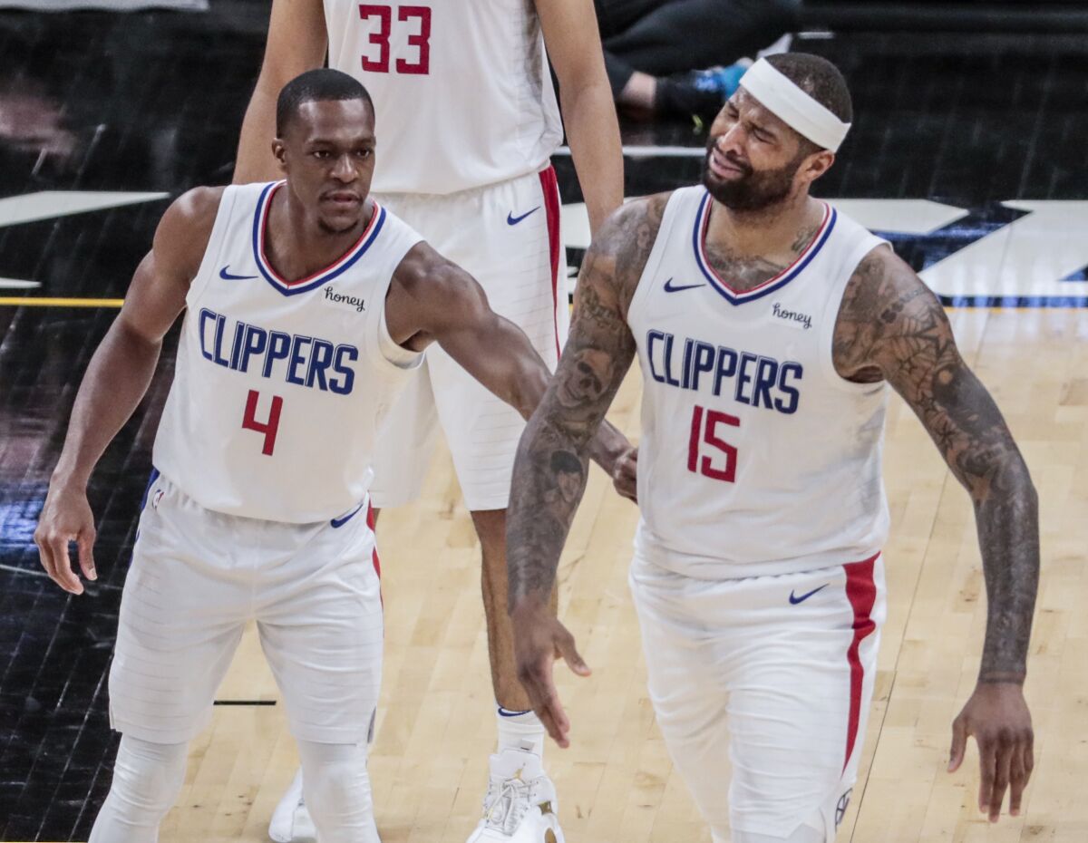 Clippers center DeMarcus Cousins (15) shows frustration after fouling Suns forward Dario Saric.