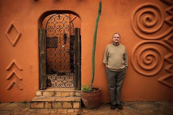 Alan Donovan, 70, was born in Colorado and attended UCLA but has lived in Africa since the U.S. State Department sent him to Nigeria as a relief officer in 1967. His home, billed as the most photographed on the continent, owes its architectural flourishes to sources ranging from Nigerian mud palaces to Timbuktu mosques. Inside are 6,000 pieces of arts and crafts reflecting a lifetime's immersion in Africana as a collector, dealer and patron. Every detail is carefully arranged, from the sinks of Moroccan brass to a bathtub of Swahili plasterwork.