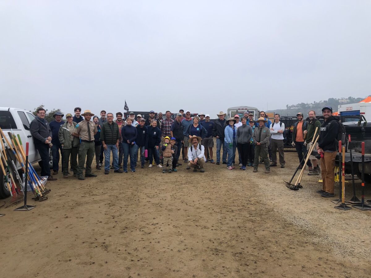 A group of volunteers began work on the Coast to Crest Trail at Surf Sports Park on Dec. 4.