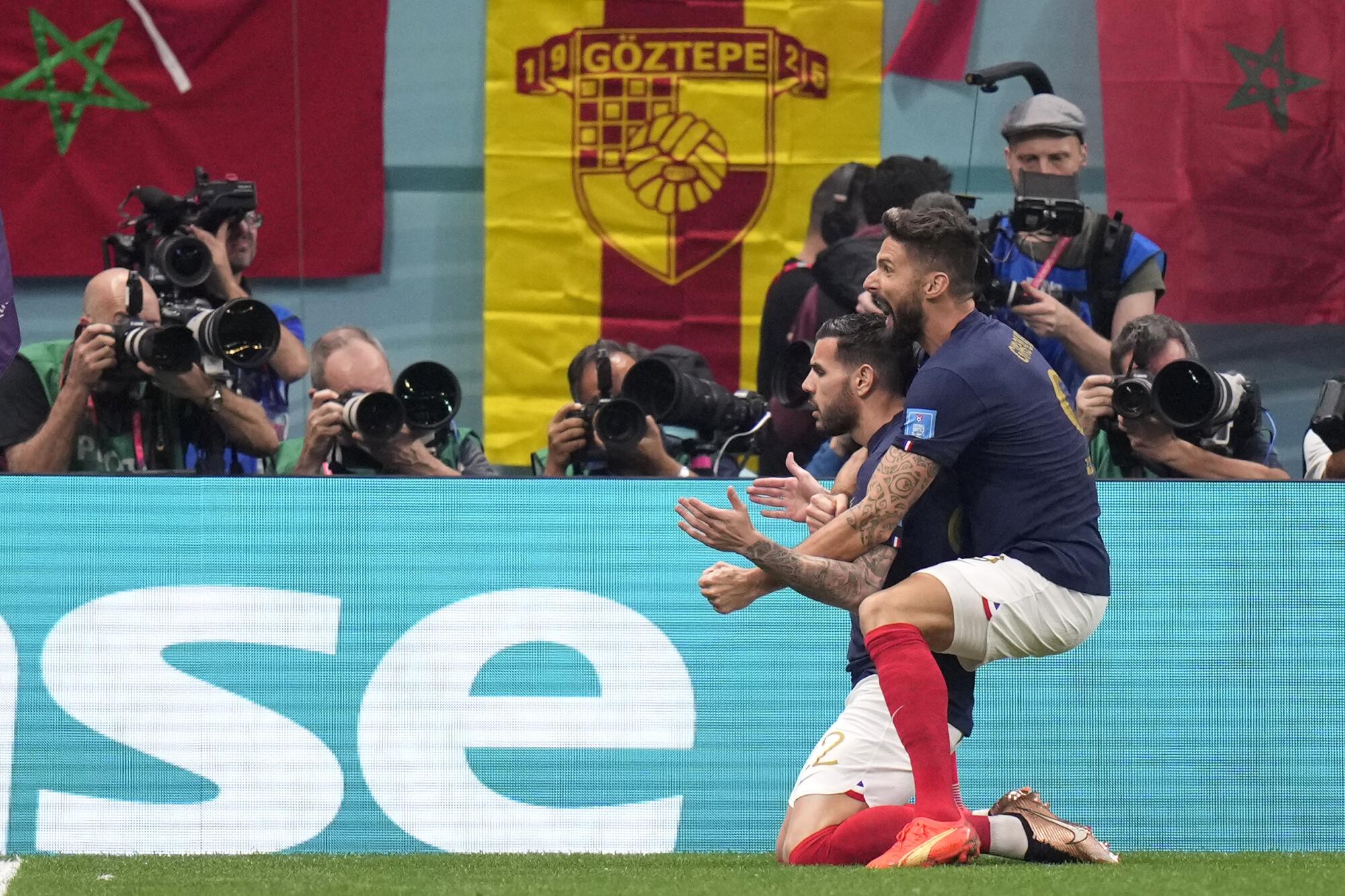 France's Theo Hernandez celebrates with Olivier Giroud after scoring his side's first goal.