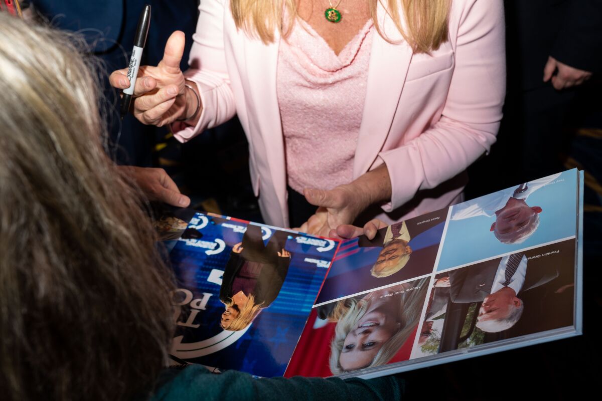 Rep. Marjorie Taylor Green (GA) signing autographs at CPAC