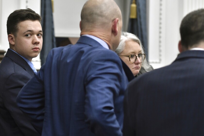 Kyle Rittenhouse looks back before going on a break during his trail at the Kenosha County Courthouse in Kenosha, Wis., on Monday, Nov. 15, 2021. (Sean Krajacic/The Kenosha News via AP, Pool)