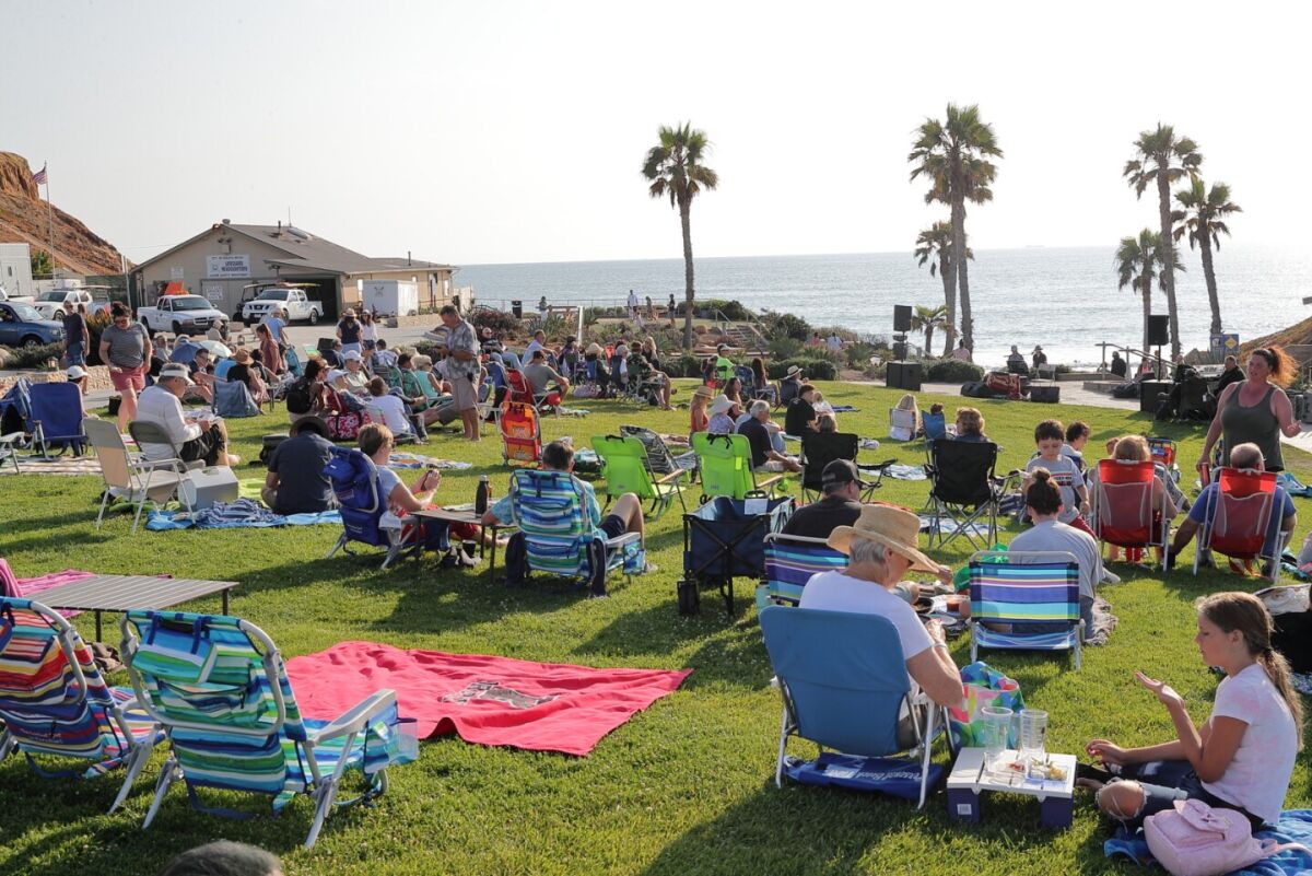The audience gathers before a summer concert at Fletcher Cove last year.