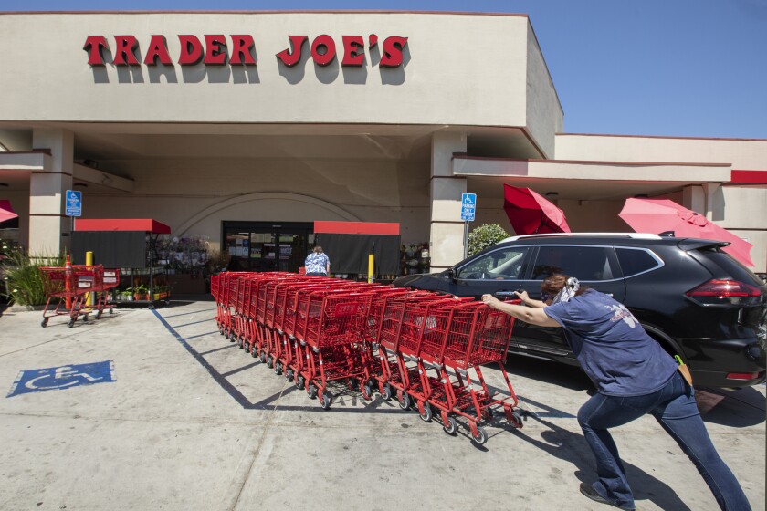 Starbucks, Target, Trader Joe's are dropping mask rules. Why
California is stopping them for now 3 SHERMAN OAKS, CA -JULY 20, 2020: Shopping carts are returned to a collection area outside of Trader Joe's on Riverside Dr. In Sherman Oaks. Trader Joe's has responded to criticisms about its packaging by announcing that it is in the process of eliminating labels that use ethnic-sounding names intended to be humorous. The offending products bear such labels as Trader Ming's for foods and condiments related to Chinese cuisine, Trader Jose's for Mexican-style products and Trader Giotto's for Italian-themed items. (Mel Melcon / Los Angeles Times)