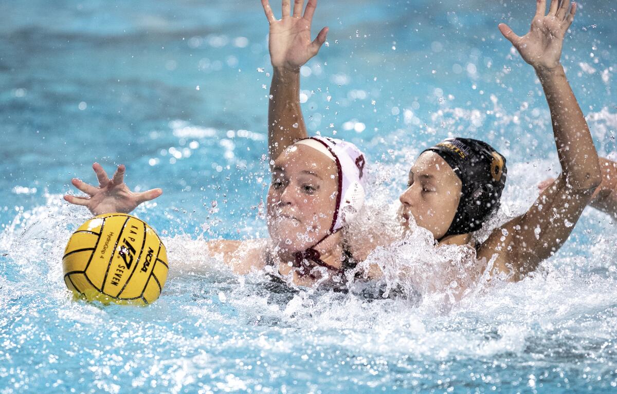 Laguna Beach's Charlotte Riches battles for a ball against Foothill's Kirra Pantaleon on Feb. 15.