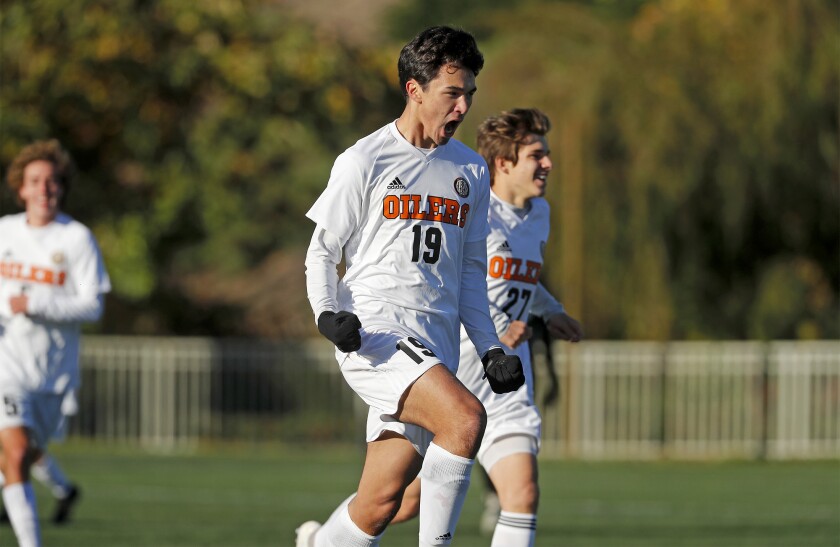 Huntington Beach senior Brandon Francis (19) celebrates scoring the only goal against Costa Mesa in the second half of a Hawks Invitational pool-play match at Lake Forest Sports Park on Friday.