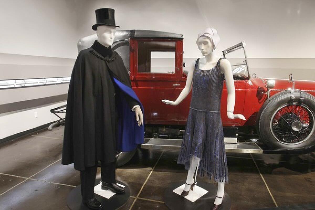 A 1927 Rolls-Royce Phantom I Town Landaulet by Hooper is paired with a 1920s black wool men's Joseph Cipolari evening cape and a 1928 Gabrielle "Coco" Chanel dress in gray silk tulle with metal sequins.