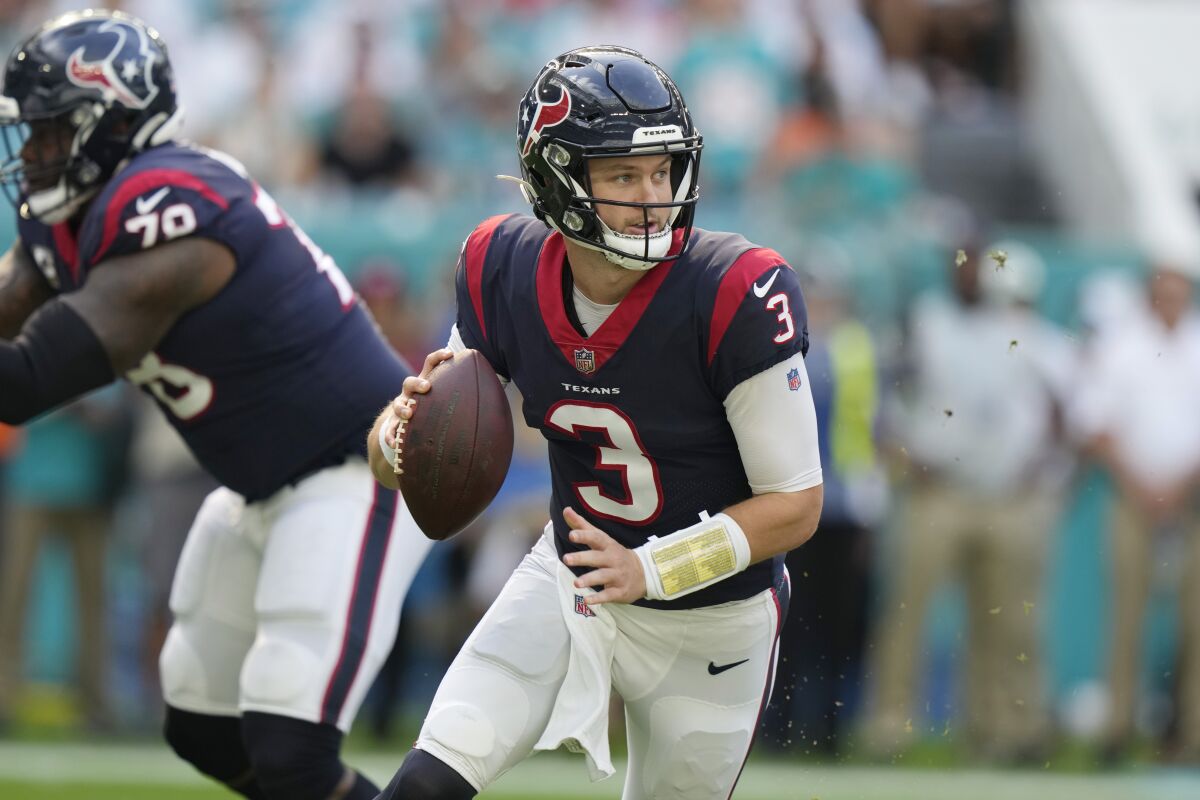 Houston Texans quarterback Kyle Allen (3) looks to pass the ball during the first half of an NFL football game against the Miami Dolphins, Sunday, Nov. 27, 2022, in Miami Gardens, Fla. (AP Photo/Lynne Sladky)