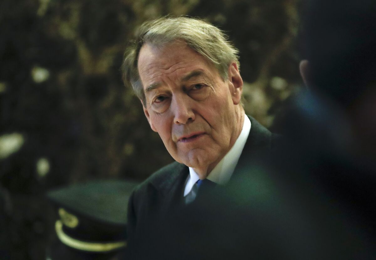 FILE -Charlie Rose walks through the Trump Tower, Monday, Nov. 21, 2016 in New York. Charlie Rose, whose career as a journalist imploded in 2017 due to sexual misconduct allegations, emerged Thursday, April 14, 2022 by posting online a lengthy interview he conducted with investor Warren Buffett.(AP Photo/Carolyn Kaster, File)