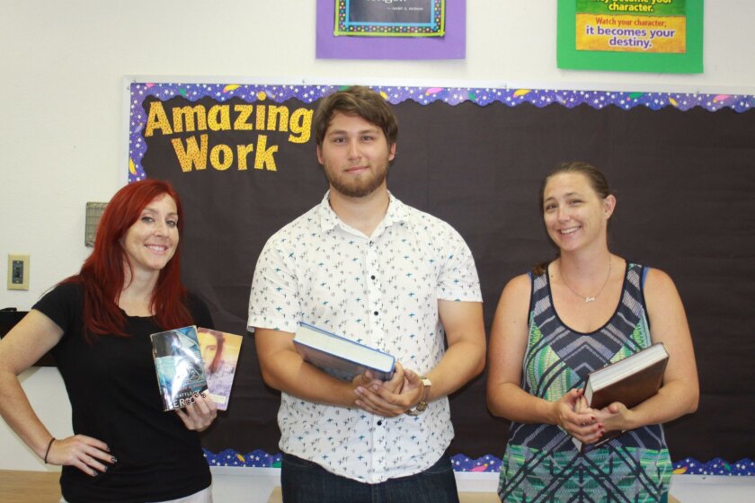 New Muirlands Middle School teachers Frances Disney, Matthew Hartje and Amy Thomas arrive on campus Aug. 15 to start setting up their classrooms.