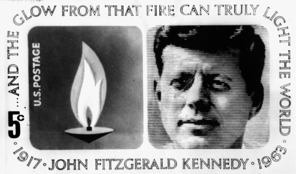 Commemorative 1964 U.S. postage stamp with a portrait of President John F. Kennedy and a representation of the eternal flame at his grave.