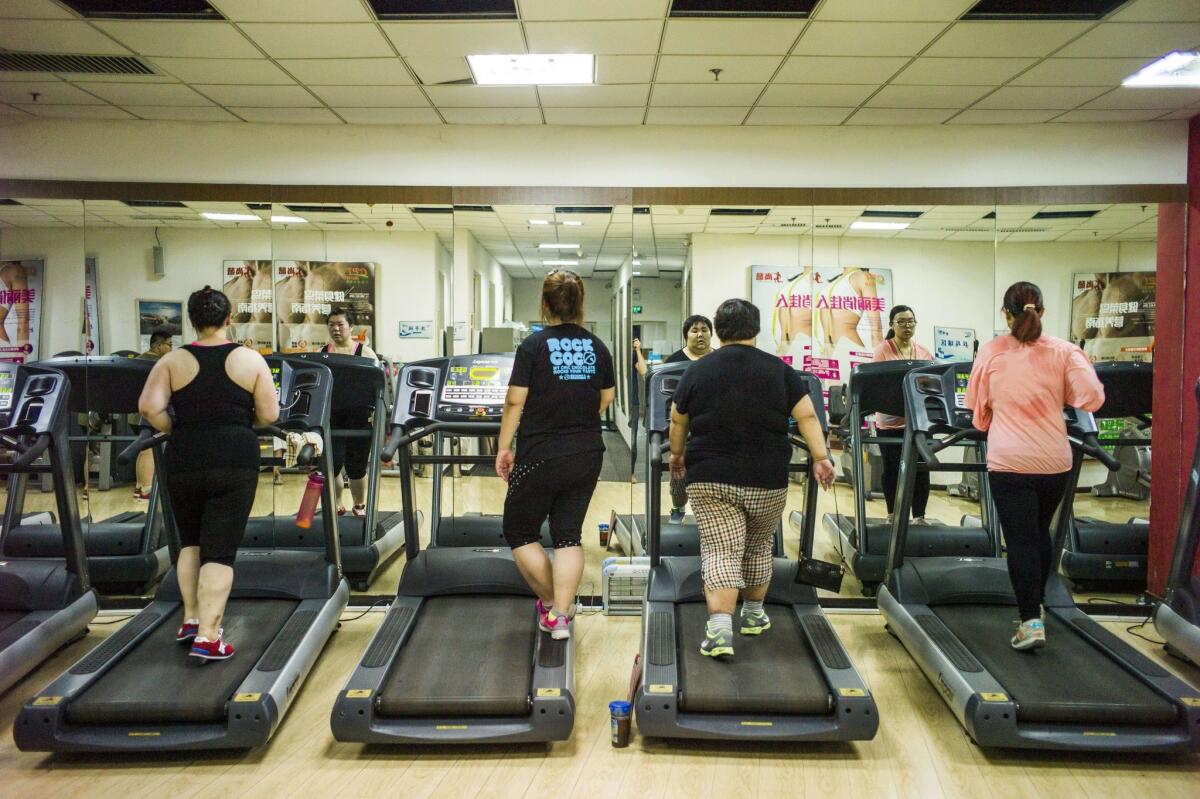 People exercise at the Aimin Fat Reduction Hospital in Tianjin, China. Internet memes supposedly gauging physical attractiveness have gained popularity in the country.