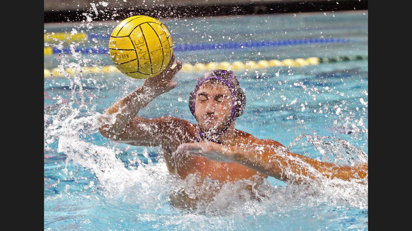 Hoover's Levon Tarverdov slaps a pass into the goal to score the game tying goal against Dos Pueblos' Jason Teng in a CIF SS Division II first-round playoff boys' water polo match at Burbank High School on Wednesday, November 9, 2016. Hoover won the match 12-8 in overtime.